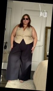 A plus size woman in a Tailored Vest workwear outfit