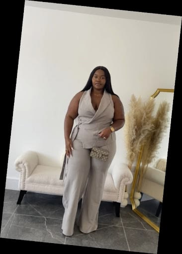 Some Chic Office Outfits for Plus Size Queens, style with class! 5 A plus size woman in Taupe/Greige sleeveless wrap-style vest with side buckle Matching taupe wide-leg trousers Mini monogram designer handbag Gold watch and delicate necklace