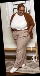A plus size woman in Cozy Corporate workwear outfit.