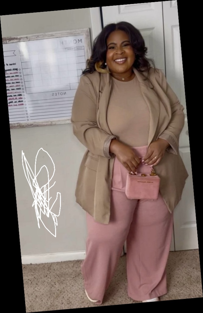 A plus size woman in Dusty Rose & Camel workwear