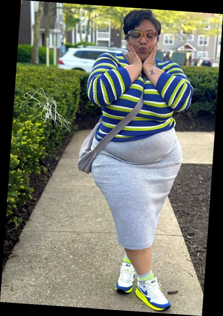 Right here are some pretty much affordable outfits for every plus size queen 10 A plus size woman wearing Blue, green, and white striped long sleeve top
Grey jersey midi skirt
White, blue, and lime green Nike Air Max sneakers
Grey crossbody bag
Multi-colored frame glasses