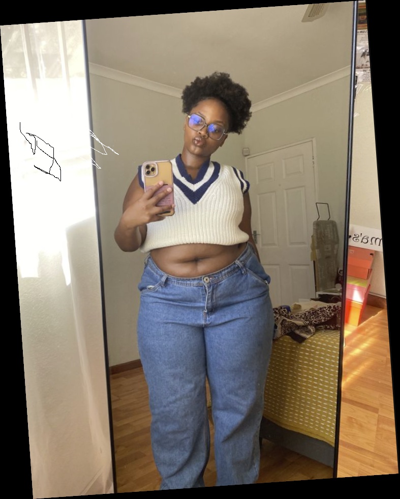 Right here are some pretty much affordable outfits for every plus size queen 5 A plus size woman wearing White V-neck sweater vest with navy blue stripes Medium wash loose-fit jeans Blue-light blocking glasses