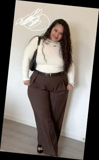 Some Chic Office Outfits for Plus Size Queens, style with class! 10 A plus size woman in Cream/Off-white ribbed turtleneck sweater Dark chocolate brown wide-leg trousers Black leather belt with gold buckle Black shoulder bag Black platform sandals Gold necklace