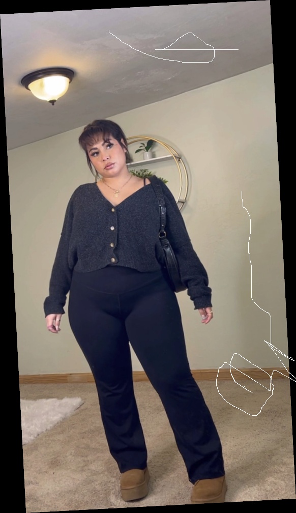 Ideal summer outfit for plus size women 8 A plus size woman wearing Charcoal grey button-up cardigan Black high-waist flared leggings/yoga pants Tan platform clogs Small black shoulder bag Gold layered necklaces
