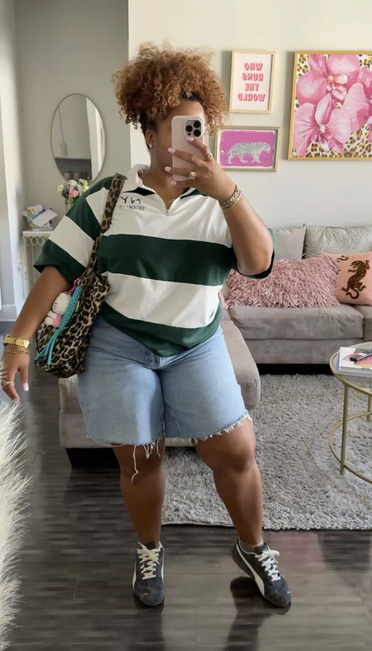 A plus size woman wearing Green and White Striped Polo Shirt, short-sleeved, with a small logo on the chest Light Wash Denim, Wide-Leg Shorts with raw hem Dark Green Sneakers with a white detail (looks like Pumas) Leopard Print Tote Bag Gold Layered Necklaces Gold Watch Gold Rings White Socks