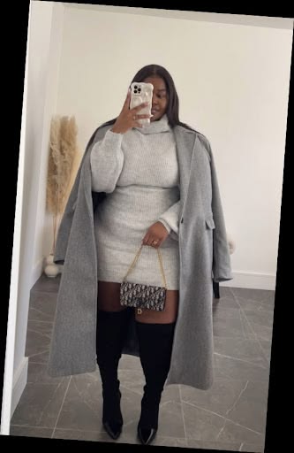 Some Chic Office Outfits for Plus Size Queens, style with class! 3 A plus size woman in Light grey turtleneck sweater mini dress Longline heather grey wool overcoat Black over-the-knee boots Designer monogram flap handbag with gold chain strap Gold rings