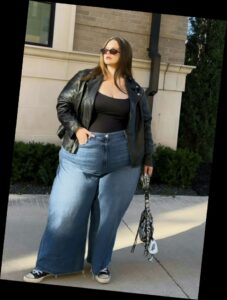 For the baddie girlies, here are some ways to eat up that baddie look 5 A plus size woman in Black motorcycle jacket Black camisole Blue wide leg jeans Black and white high-top sneakers Small black handbag Oversized black square sunglasses Gold necklace