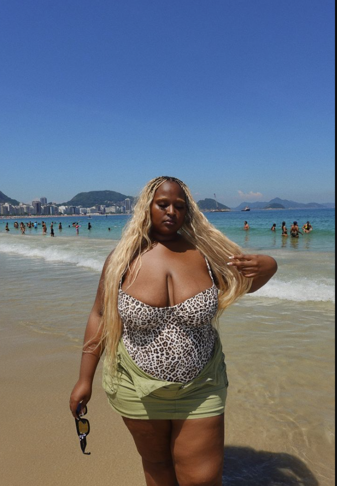 Beach Queen Energy: Stylish Outfits for Plus Size Women by the Sea 6 A plus size woman wearing Leopard print underwire balconette one-piece swimsuit
Olive green low-rise cargo mini skirt with pocket detailing
Black acetate sunglasses