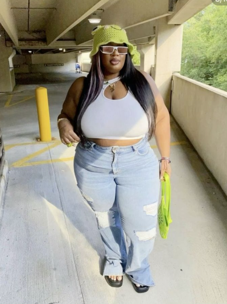 After Dark Glow: Baddie Night Out Outfits for Plus Size Women 8 A plus size woman wearing White keyhole halter crop top
Light-wash high-waisted ripped baggy jeans with split hems
Lime green crochet bucket hat
Lime green nylon shoulder bag
White thick-frame rectangular sunglasses
Black leather platform slide sandals
Gold layered necklaces