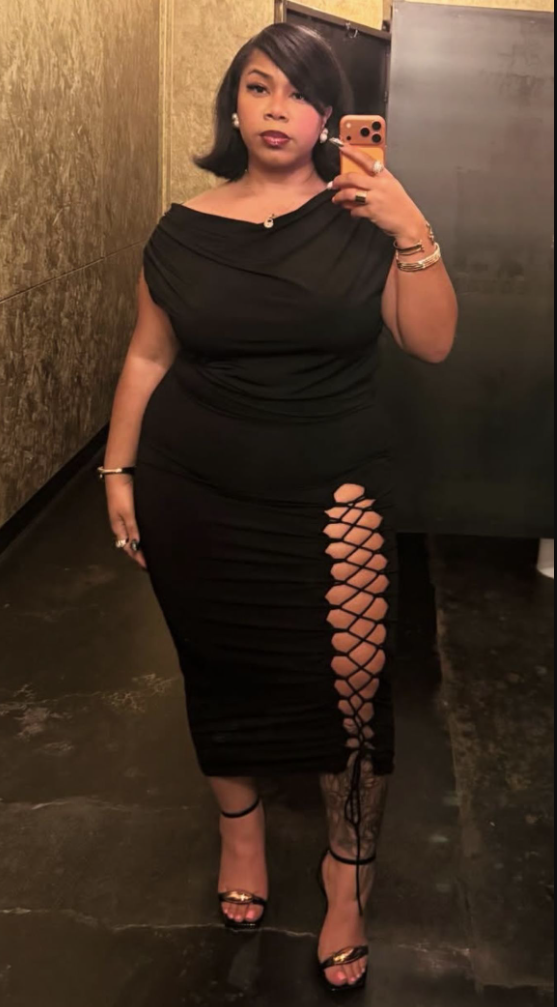 Daytime Charm: Cute & Comfortable Lunch Outfits for Plus Size Women 8 A plus size woman wearing Black off-shoulder ruched midi dress with lattice side cutouts Black strappy heeled sandals with gold details Pearl earrings Gold and silver jewelry Side-part bob hairstyle
