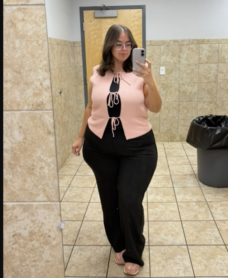 A plus size woman wearing White Front Tie Top Black inner shirts Black wide leg pants Nude flat shoes