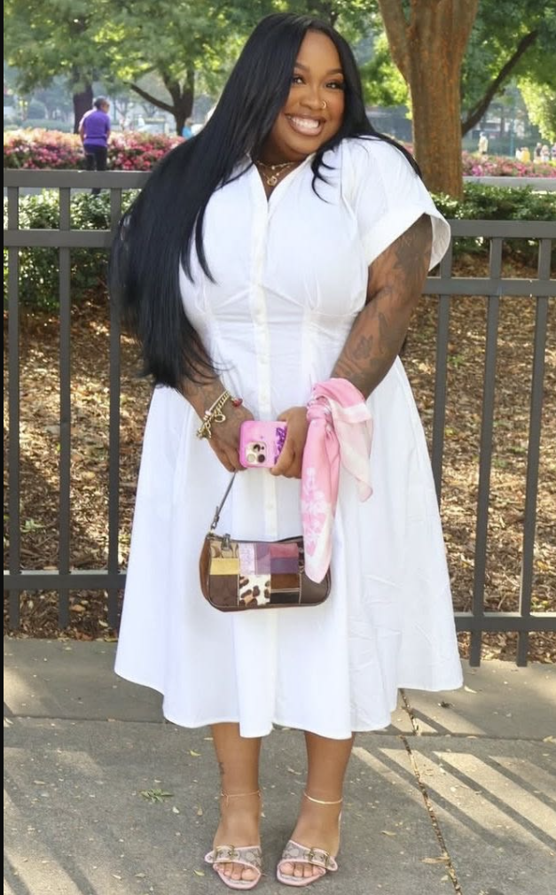 A plus size woman wearing White short sleeve shirt dress
Pink patterned scarf
Multi-color patchwork crossbody bag
Pink heeled sandals